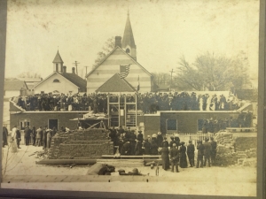 Construction of school building in 1914. The school still stands behind the current church building.